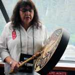 The Douglas Indian Association hosted an all-day boat trip to former Native village sites and the Taku Inlet on Friday. In this photo, Jeannie Lee sings and drums.