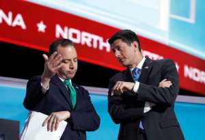 Speaker Paul Ryan of Wisconsin and Reince Priebus, Chairman of the Republican National Committee talk while Alaska recounts their votes during the second day of the Republican National Convention in Cleveland, Tuesday, July 19, 2016.(AP Photo/Carolyn Kaster)
