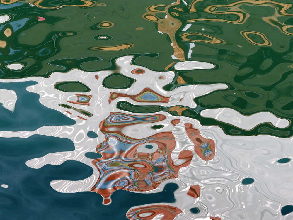 Reflection abstract - a sunny afternoon in the downtown Juneau harbor. Photo by Brooke Daly.