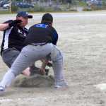 Third baseman for  Thibideau's Kenny's Liquor, Chad Dubois, lays down a tag on Nick Andrews from Sitka team E.L.I. during the 41st annual Jamie Parsons Rainball Tournament on Saturday.