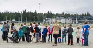 Children and their parents watch a rocket return to the ground during Science Friday at the Mendenhall Valley Public Library on Friday. The event was made possible by the Juneau Public Library and the Seattle Museum of Flight.