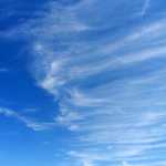 Wispy cirrus clouds resembling mares' tales appear in the sky above Nantucket Sound, Cape Cod.