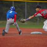 A Gastineau Channel Little League all-star juniors player tags out a Sitka Little League player at second base in the fifth inning of a District 2 tournament game in Sitka. Juneau won the district and will play against Anchorage's District 1 winner in a best of five series for the state championship starting Tuesday.