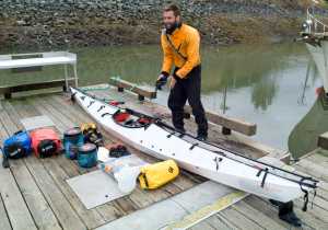 Austin Jones stands next to his  foldable kayak after finishing a 59-day, 1,170-mile trip from Anacortes, Washington, to Juneau on Tuesday.
