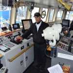 Tustumena captain John Mayer explains the improvements to the ship's wheelhouse Monday, Oct. 21, 2013. (James Brooks photo)