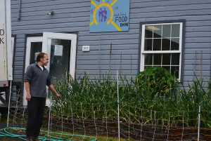 ADVANCED FOR WEEKEND USE SATURDAY, JULY 30, 2016 - In this 2016 photo, Alexander von Tsurikov shows a garden at the Kodiak Island Food Bank in Kodiak, Alaska. As director of the Kodiak Island Food Bank, Tsurikov hunts for donations, making three or more rounds each day to local stores. (JoAnn Snoderly/Kodiak Daily Mirror via AP)