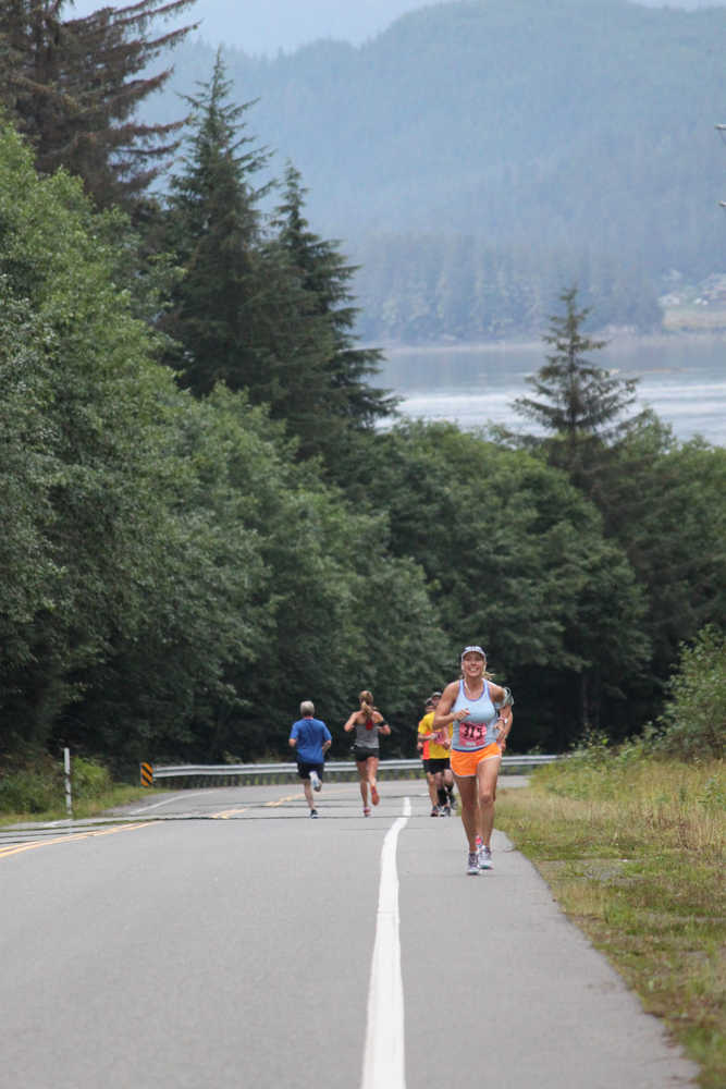 Cynthia Perkins climbs a hill near the halfway point of the Frank Maier Marathon on Saturday. Perkins was the fastest woman in the masters division.