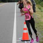 Leslie Mueca rounds a cone marking the halfway point of the Frank Maier Marathon.