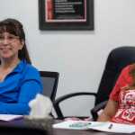 Students Sandra Edwardson, left, and Lauryn Franke, right, look towards instructor Emily Edenshaw-Chafin as she teaches a Haida language lesson at the Edward K. Thomas building on Tuesday.