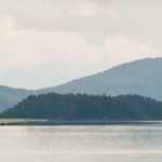 According to the U.S. Coast Guard, the 35-foot Dolphin Jet Boat Tours whale-watching boat Big Red began taking on water about 12:45 p.m. Sunday at the south end of Aaron Island, a rocky knob in the middle of Favorite Channel at the latitude of Tee Harbor.