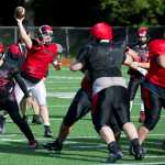 Quarterback Bubba Stults passes the ball during Juneau-Douglas High School varsity football practice at Adair-Kennedy Memorial Park on Wednesday.