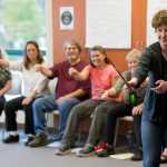 Kate Kroko, a student/teacher from Juneau, performs a 'teacher-in-role' exercise comparing violin playing to fly fishing at the University of Alaska Southeast on Thursday. The teachers were all part of the Juneau Basic Arts Institute, an annual two-week summer program during which educators and administrators learn how they can incorporate art into their classrooms on a daily basis.