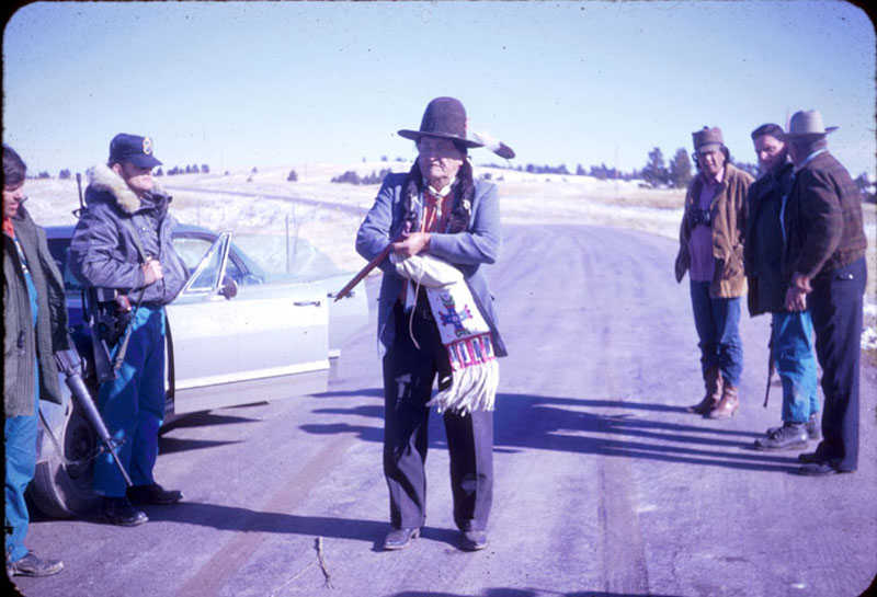Frank Fools Crow, a Lakota medicine man and elder, was let through federal lines to speak with the occupiers of Wounded Knee.