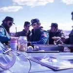 Federal marshals eat in the field during the first week of the siege at Wounded Knee. Paul and Virginia Berg, later along with others, cooked and brought food for the FBI and the marshals.