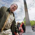 Roy A. Peratrovich Jr. with "Flight of the Raven," a sculpture he created, in Roy and Elizabeth Peratrovich Park in downtown Anchorage.