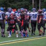 Crimson Bears senior Luis Lozada (99) gets up after a tackle Saturday.