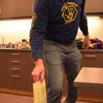 Tom Choquette drops a questioned ballot into the sealed ballot box on Tuesday at the polling location in the Andrew P. Kashevaroff State Library, Archives and Museum. The SLAM, which opened this summer, hosted a polling station during Tuesday's statewide primary.