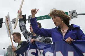 This Aug. 12 photo shows U.S. Sen. Lisa Murkowski, R-Alaska, campaigning at a busy street corner in Anchorage.