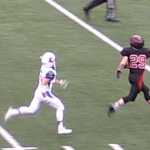 Crimson Bears wide receiver Tyler Collins (29) runs down field as he prepared to haul in a catch after beating two Kodiak High School defenders during Friday's game at Adair Kennedy Field. Kodiak won 26-20.