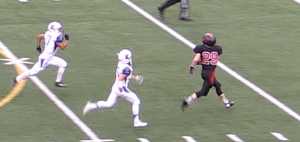 Crimson Bears wide receiver Tyler Collins (29) runs down field as he prepared to haul in a catch after beating two Kodiak High School defenders during Friday's game at Adair Kennedy Field. Kodiak won 26-20.