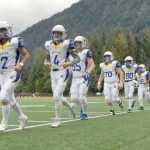 The Kodiak High School Bears take the field Friday prior to their game against Juneau-Douglas High School at Adair Kennedy Field. Kodiak won 26-20.