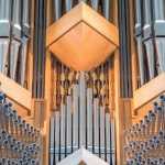 Symmetrical shapes on a pipe organ.