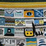 This is part of the "Weavers Across the Water" robe that will be debuted at the dedication of Xunaa Shuká Hít in Glacier Bay. Forty Ravenstail and Chilkat weavers from around the Pacific Northwest contributed a square measuring around five inches by five inches. Master weaver Clarissa Rizal wove the border around the robe, a pattern called "Mating Loons." The robe will get its first use during the dedication ceremony for Xunaa Shuká Hít, the Glacier Bay tribal house.