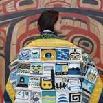 Lily Hope wears the "Weavers Across the Water" robe during its progress (the bottom was yet to be completed.) She is one of the weavers who contributed a square to the robe, which is an idea of her mother, master weaver Clarissa Rizal, who's been spending the last month putting the pieces together and weaving the border.