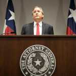 FILE - In this May 25, 2016, file photo, Republican Texas Attorney General Ken Paxton announces Texas' lawsuit to challenge President Obama's transgender bathroom order during a news conference in Austin, Texas. A federal judge in Texas is blocking for now the Obama administration's directive to U.S. public schools that transgender students must be allowed to use the bathrooms and locker rooms consistent with their chosen gender identity. Paxton had argued that halting the law before school began was necessary because districts risked losing federal education dollars if they didn't comply. (Jay Janner/Austin American-Statesman via AP)