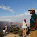 Grand Canyon National Park intern Mi-Kal White waits for visitors to approach him for assistance on July 26, 2016. As the National Park Service prepares to celebrate its 100th anniversary on Aug. 25, the agency is working to attract more minorities to the country's national parks and monuments as the demographics of America are expected to change dramatically in the coming years. (AP Photo/Beatriz Costa-Lima)
