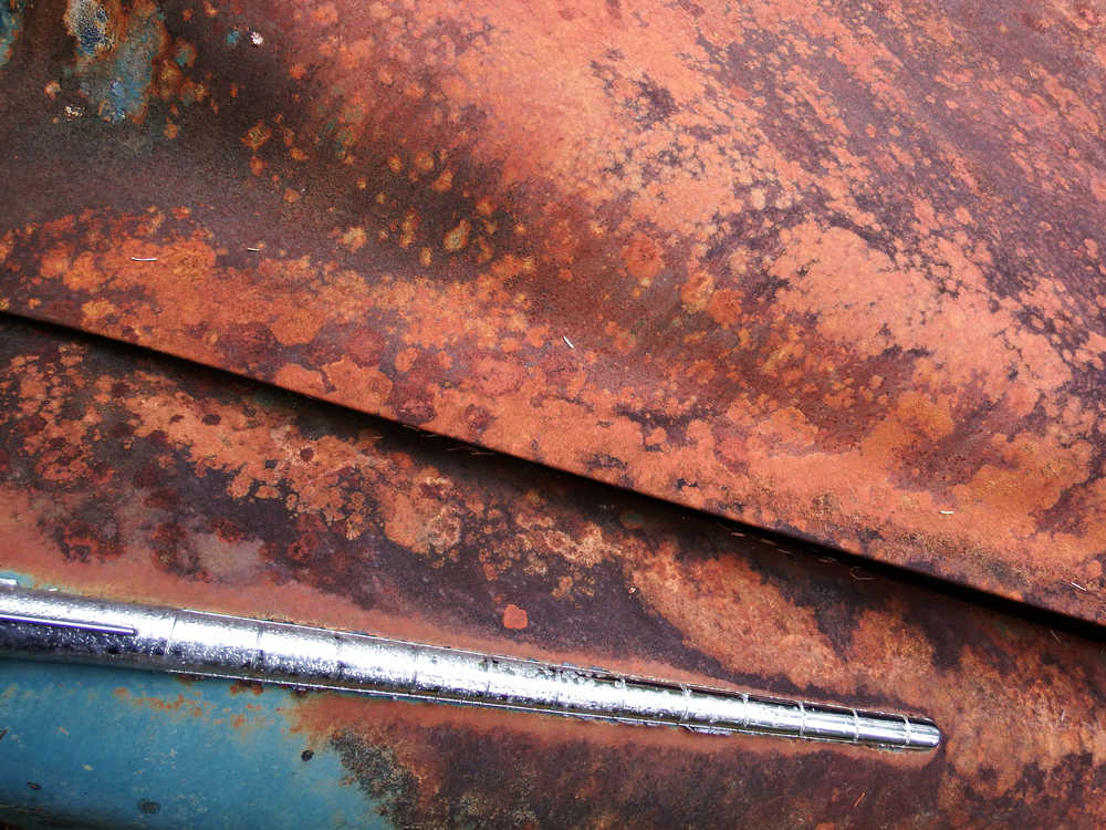 Rust never sleeps, but chrome never rusts.  Chrome still shines on a rusty car near the Tolch Rock Trail in August 2016.