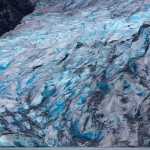 Mendenhall Glacier's blue ice towers over Mendenhall Lake on Aug. 19.