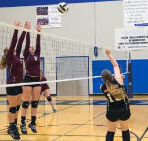 Sophomore Alanna Berry, left, and Junior Jenny Strassburg for the Ketchikan Lady Kings attempt to block a shot from JDHS sophomore Shaylin Cesar.