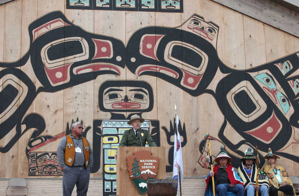 Glacier Bay National Park and Preserve superintendent Philip Hooge speaks on the long effort to establish the tribal house as Frank Wright, left, and clan leaders, right, listen. "The park is honored by the opportunity to be a part of this great dream," he said.  The partnership between the Hoonah Indian Association and the National Park Service earned the organizations a national award, given each year to only one partnership.