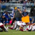 Three Ketchikan players lay on the field after a play in the second quarter at Thunder Mountain High School on Friday. With Thunder Mountain up 21-0 in the second quarter Ketchikan walked off the field citing unfair refereeing after multiple injuries to Ketchikan players. Two Ketchikan players were taken to Bartlett Regional Hospital.