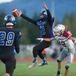 Thunder Mountain's Gabe Crawford, center, breaks up a pass intended for Ketchikan's Kody Malouf at Thunder Mountain High School on Friday. With Thunder Mountain up 21-0 in the second quarter Ketchikan walked off the field citing unfair refereeing after multiple injuries to Ketchikan players. Two Ketchikan players were taken to Bartlett Regional Hospital.