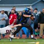 Thunder Mountain's Roy Tupou, right, breaks a tackle by Ketchikan's Michael Starr to score at Thunder Mountain High School on Friday. With Thunder Mountain up 21-0 in the second quarter Ketchikan walked off the field citing unfair refereeing after multiple injuries to Ketchikan players. Two Ketchikan players were taken to Bartlett Regional Hospital.