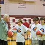 Greg Brittenham former NBA assistant coach with the New York Knicks coaching the youth at "I did. You Can." basketball camp for athletes with special needs, Staturday at JDHS Gymnasium.