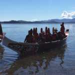 St'igiinii (Harley Holter) greets the canoe from Ketchikan as its paddlers pull into shore.