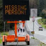 Volunteer searchers look along Auke Lake for missing Ryan Harvey, 22, on Thursday.