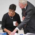 University of Alaska President Jim Johnsen, right, talks with Jo Heckman, chair of the Board of Regents, at the UAS Recreation Center on Thursday.