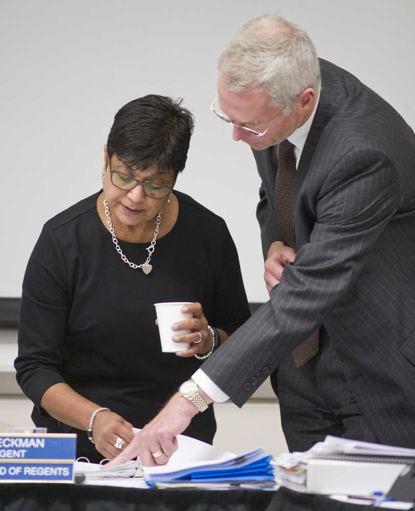 University of Alaska President Jim Johnsen, right, talks with Jo Heckman, chair of the Board of Regents, at the UAS Recreation Center on Thursday.