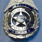 Officer Sean Ahshapanek wears badge number 199 after being sworn into the Juneau Police Department on Friday.