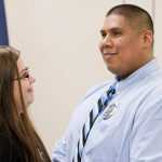 Officer Sean Ahshapanek with his long-time partner, Barbara Dude, after she pinned his badge number on after being sworn into the Juneau Police Department on Friday.