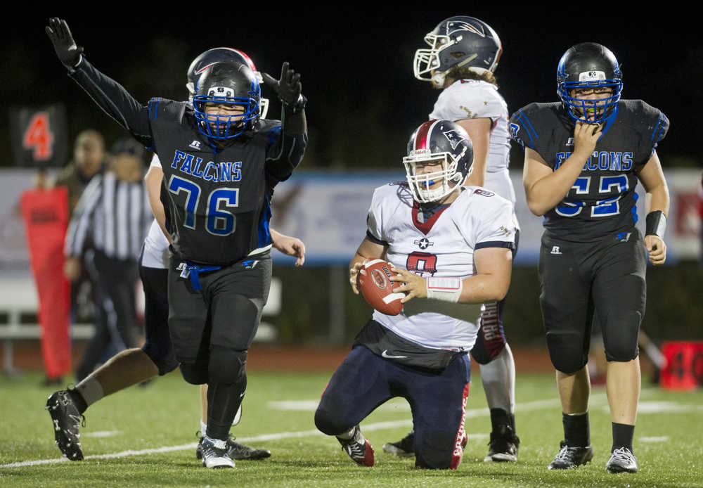 Thunder Mountain's Ivan Williams celebrates sacking North Pole's quarterback Craig Borba in the final minute of the game at TMHS on Friday. TMHS won 22-20
