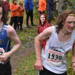 Juneau-Douglas' Arne-Ellefson Carnes passes Thunder Mountain's Wyatt Graber at the Juneau Invitational cross country meet Saturday at Savikko Park.