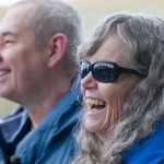 Wendy Yoisten, with her husband John, of St. Albert, Alberta, reacts to being greeted as the one millionth cruise ship passenger to arrive for the season in Juneau on Thursday. The Yoistens arrived on the Holland America Line Zaandam.
