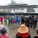 Juneau's Yees Ku Oo Dance Group welcomes Wendy Yoisten, with her husband John, of St. Albert, Alberta, to Juneau on Thursday. Wendy Yoisten, arriving on the Holland America Line Zaandam, was declared the one millionth cruise ship passenger to arrive in Juneau this season.