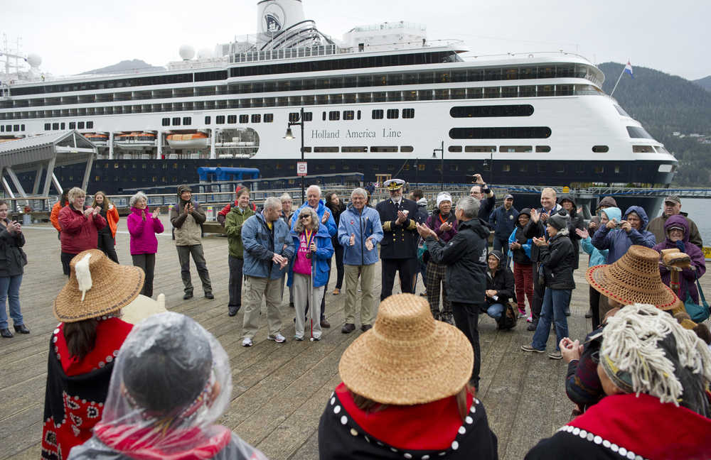 Juneau's Yees Ku Oo Dance Group welcomes Wendy Yoisten, with her husband John, of St. Albert, Alberta, to Juneau on Thursday. Wendy Yoisten, arriving on the Holland America Line Zaandam, was declared the one millionth cruise ship passenger to arrive in Juneau this season.