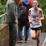 Juneau-Douglas High School sophomore Arne Ellefson-Carnes crosses the Indian River on his way to a first place finish at Saturday's Region V cross country championship meet in Sitka.